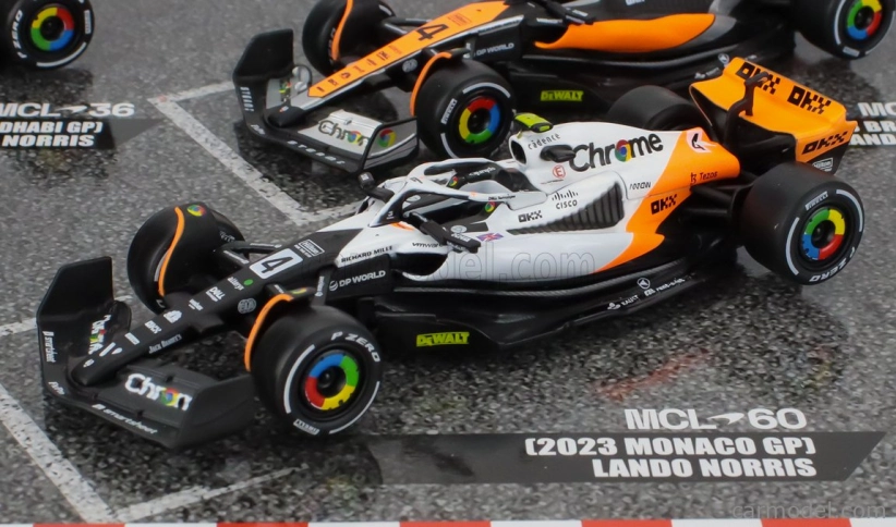 Bburago Mclaren F1 Set 4x – Team Mclaren Mcl36 N 4 Abu Dhabi Gp 2022 – Mcl60 N 4 Singapore Gp - Monaco Gp – British Gp 2023 Lando Norris 1:43 oranžová čierna biela