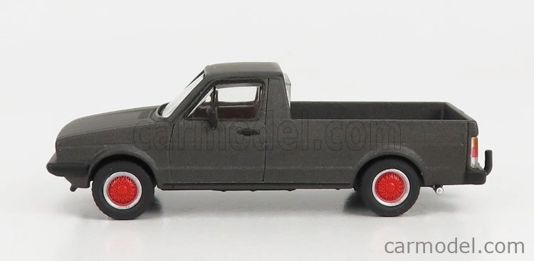 Schuco Volkswagen Caddy Pick-up otvorený 1982 1:64 sivá