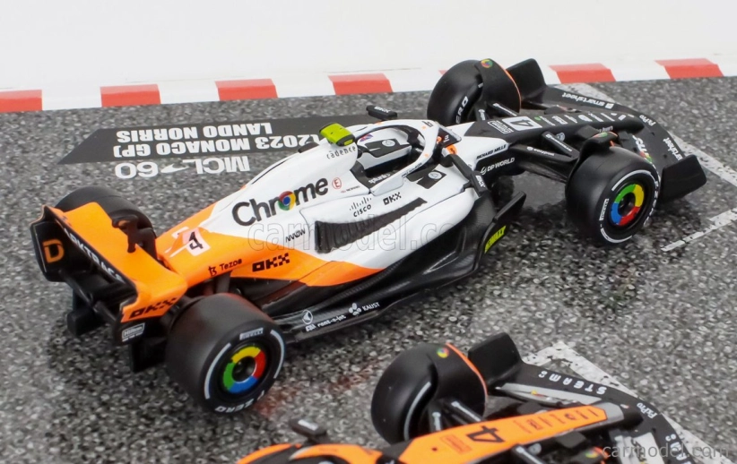 Bburago Mclaren F1 Set 4x – Team Mclaren Mcl36 N 4 Abu Dhabi Gp 2022 – Mcl60 N 4 Singapore Gp - Monaco Gp – British Gp 2023 Lando Norris 1:43 oranžová čierna biela