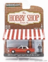 Greenlight Chevrolet Impala Capita Cab Taxi s mužom v obleku 1981 1:64 oranžová biela